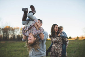 A family taking a stroll in a field in Southwest Missouri