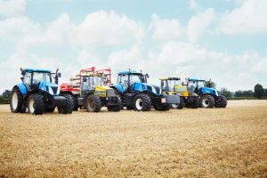 A row of tractors being set out to get ready for the work day
